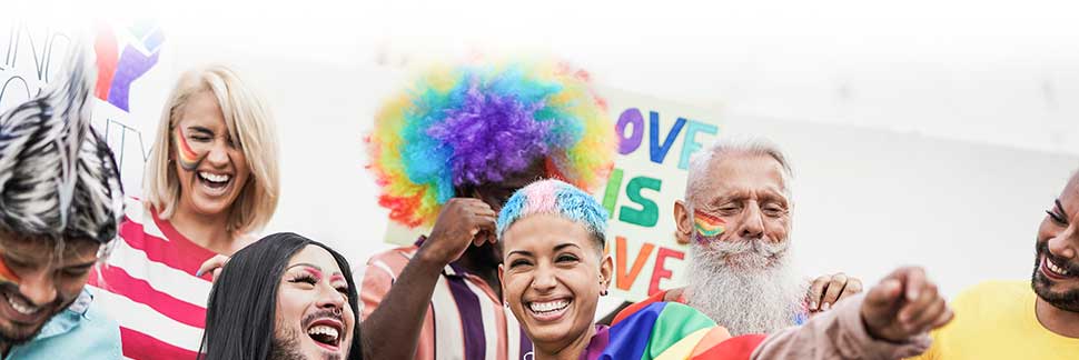 a diverse group of LGBTQIA people celebrating PRIDE week
